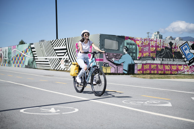 riding ebike with mural background